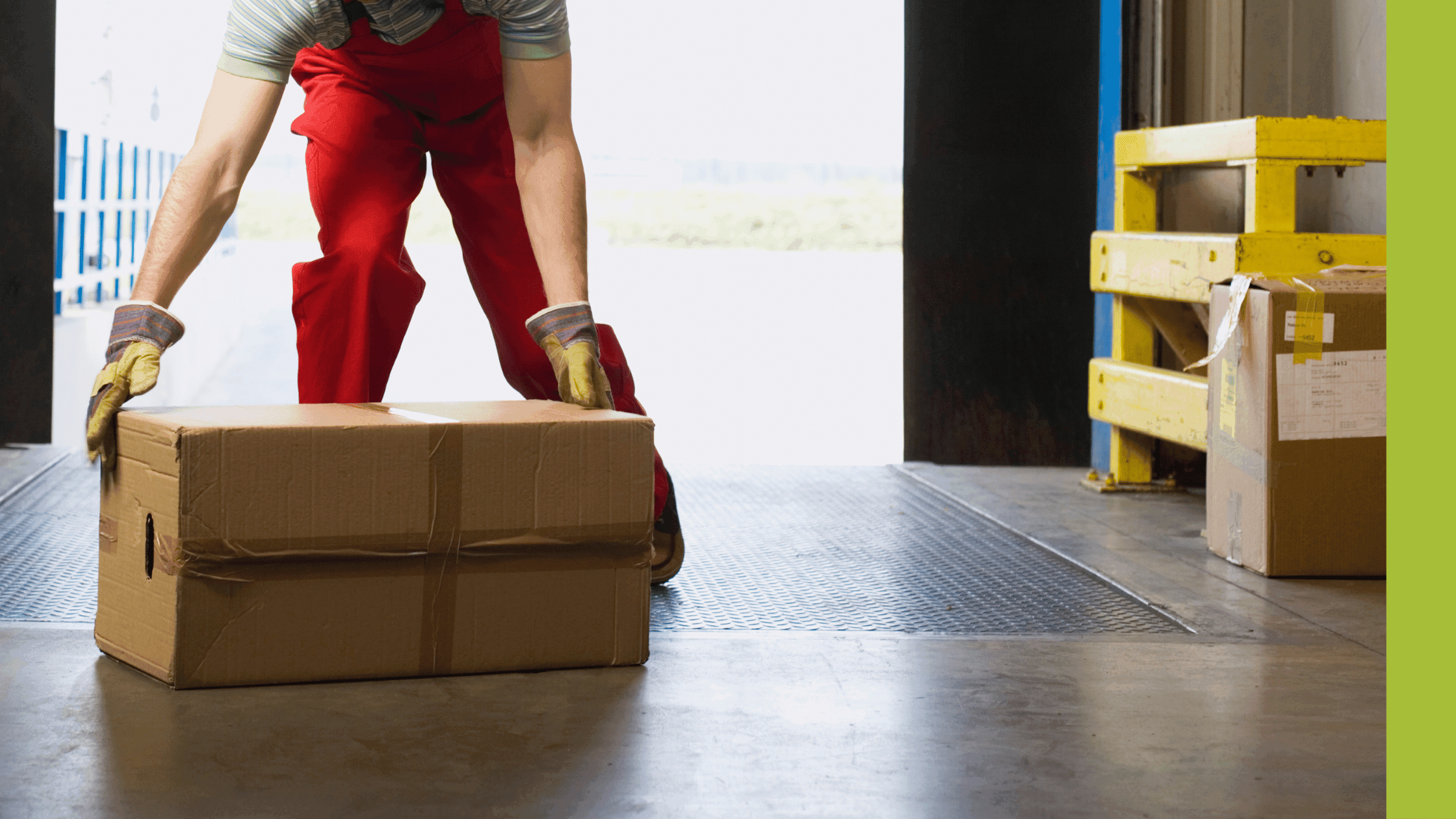 Man manually lifting a box in a manufacturing environment