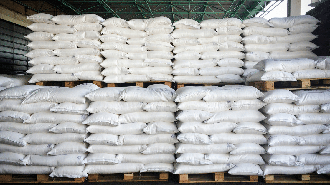 A pile of white sacks stacked neatly on pallets