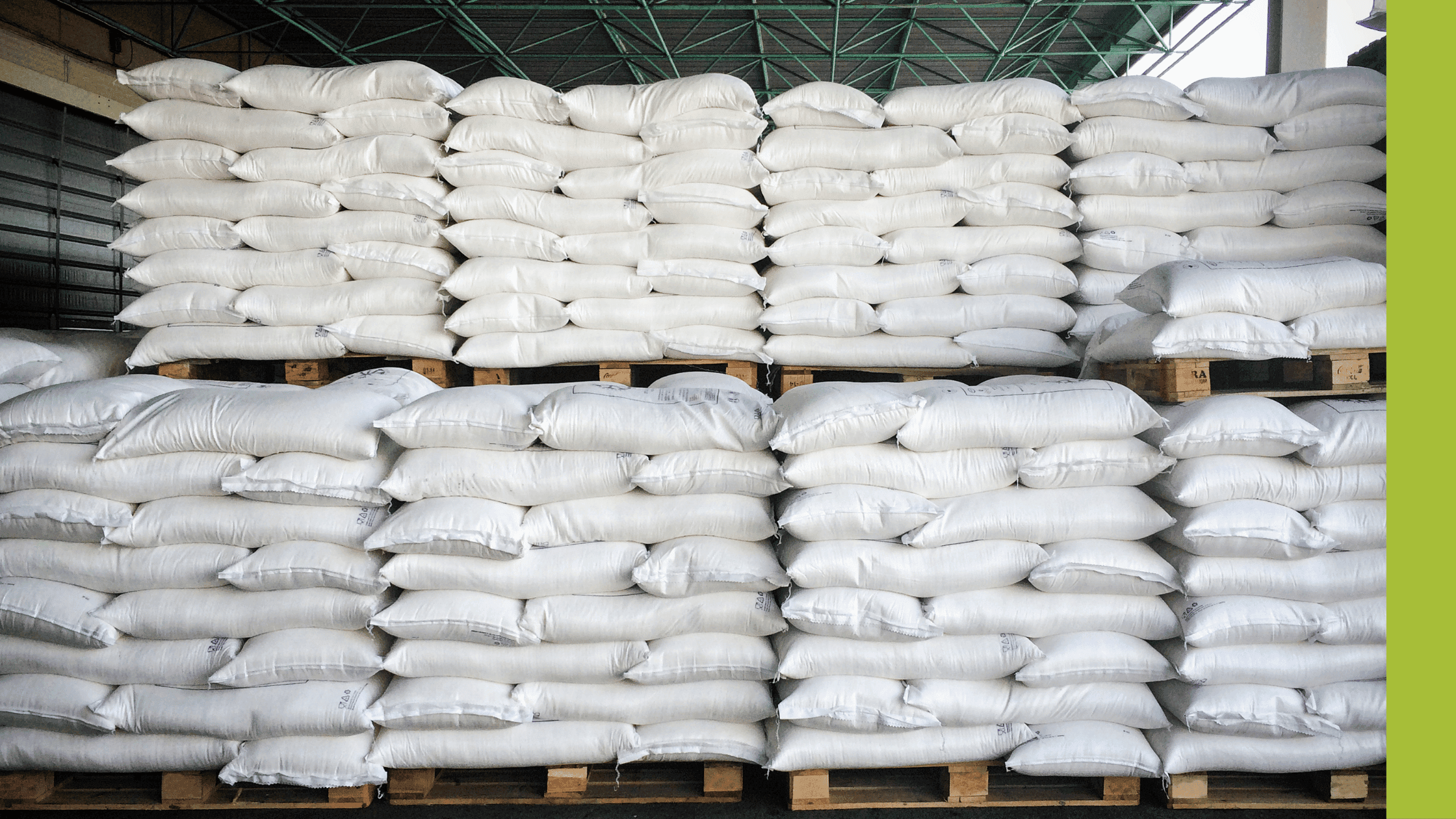 A pile of white sacks stacked neatly on pallets