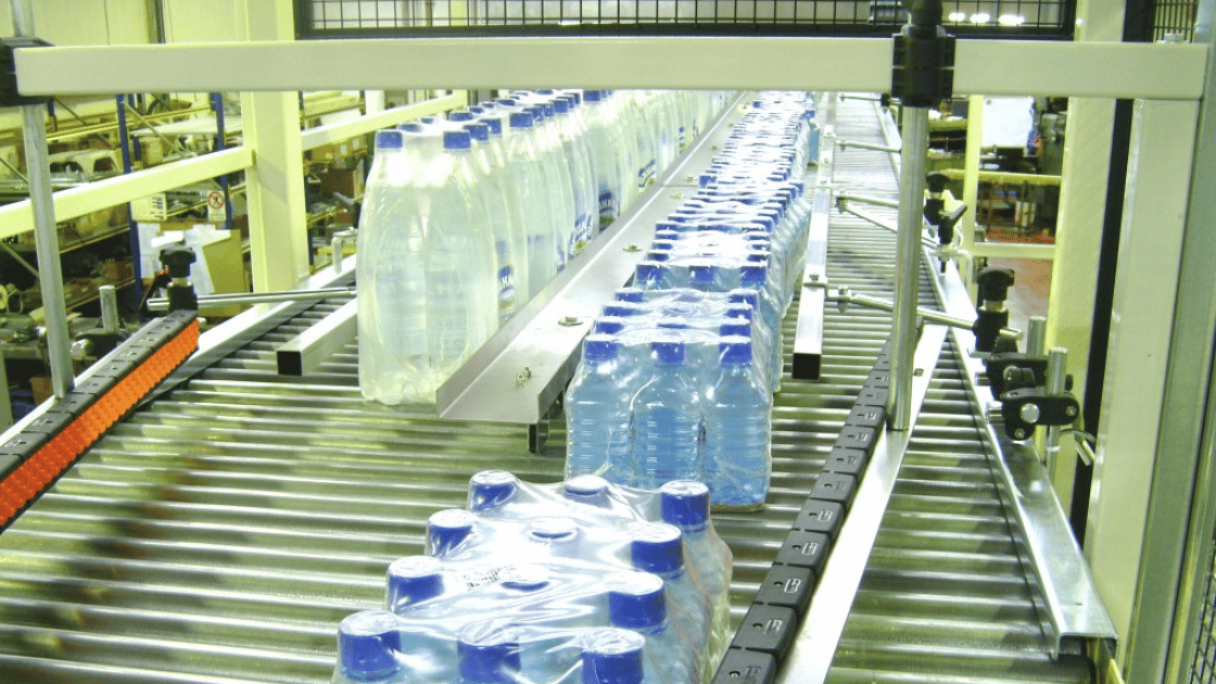 Water bottles passing through an automated conveyor