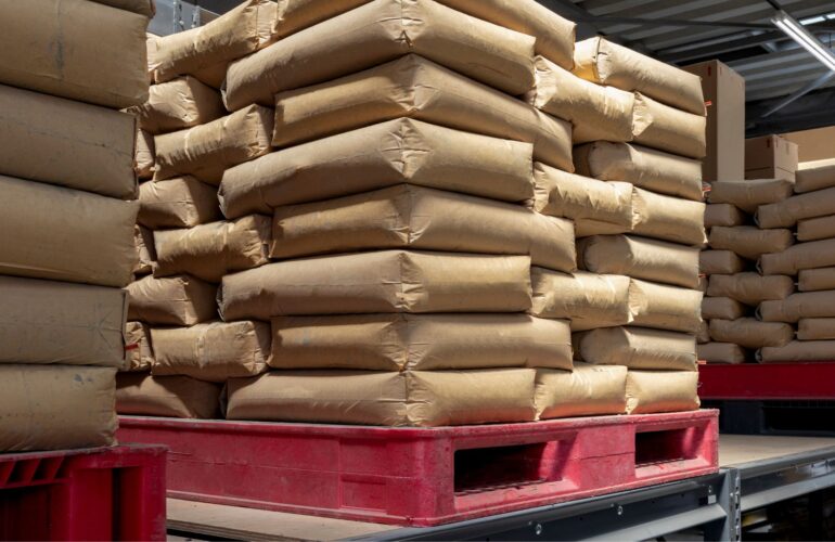 Sacks stacked on red pallets