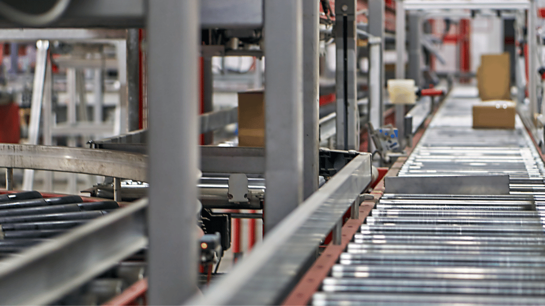 A conveyor belt in motion in a manufacturing facility